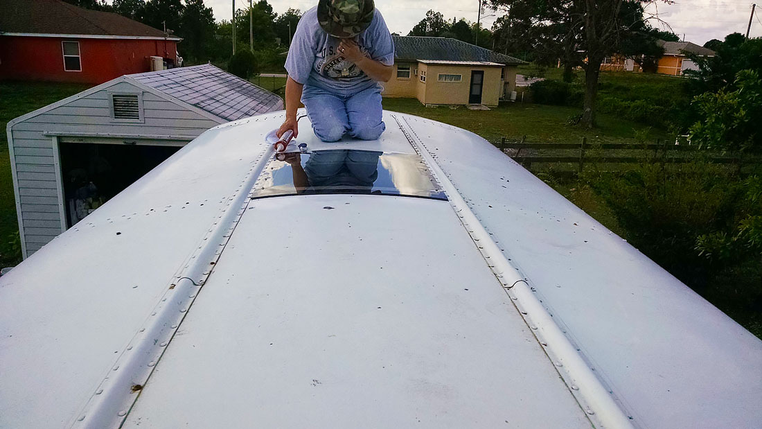 Installing the Lexan over our Skoolie escape hatches
