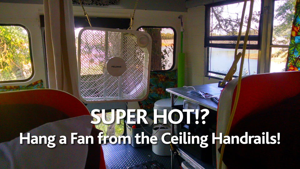 Skoolie cooling using fans hanging for the ceiling handrails