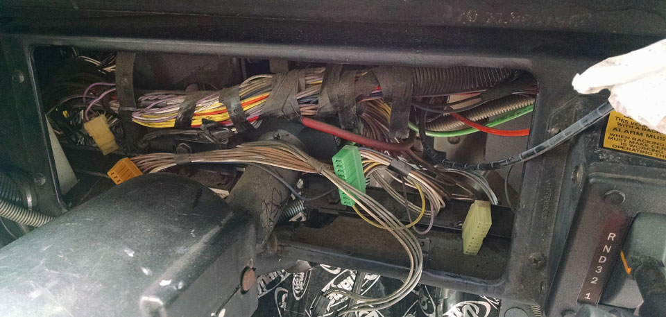 Skoolie dash removed and wires exposed